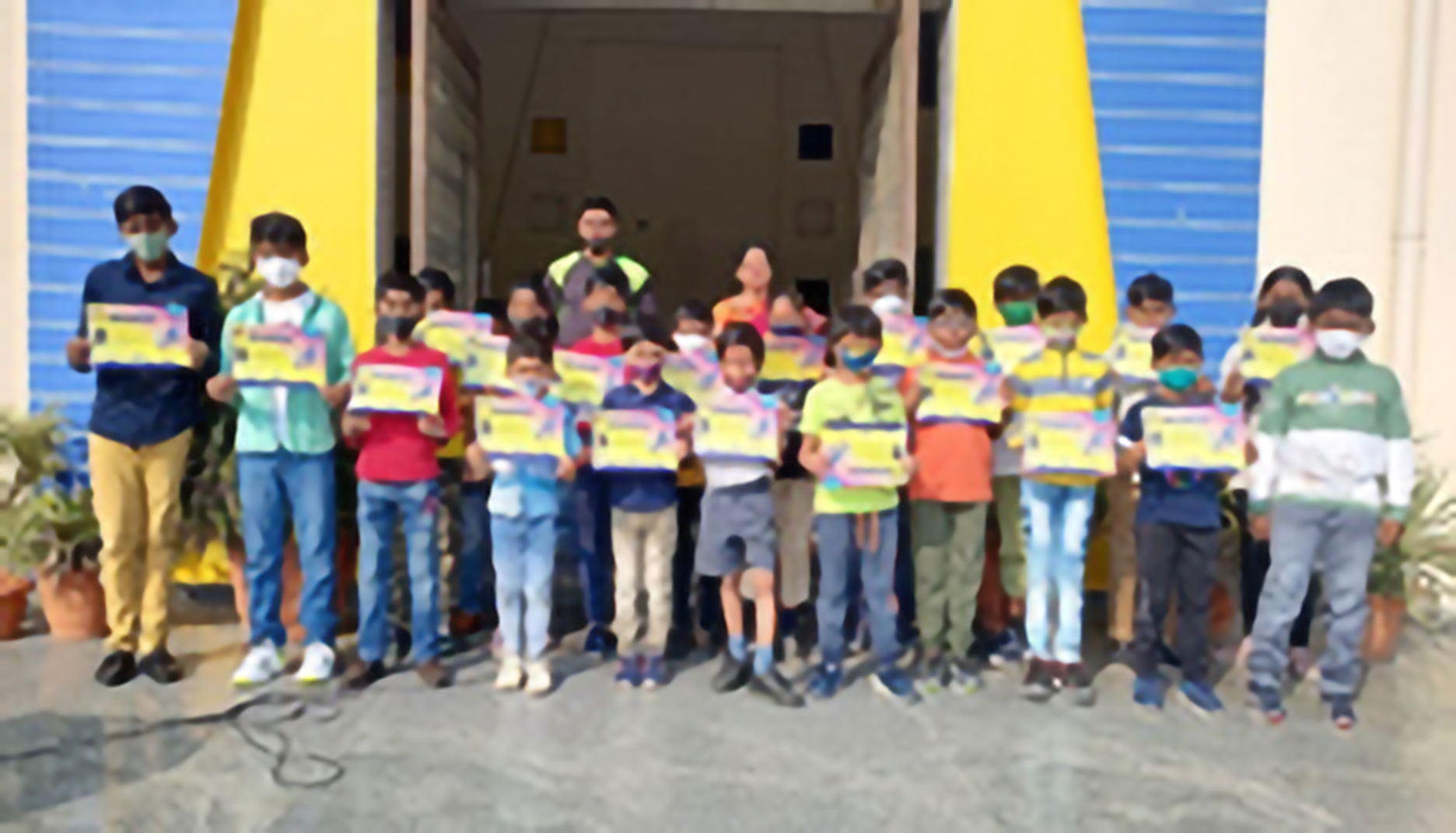 School kids are standing with certificate