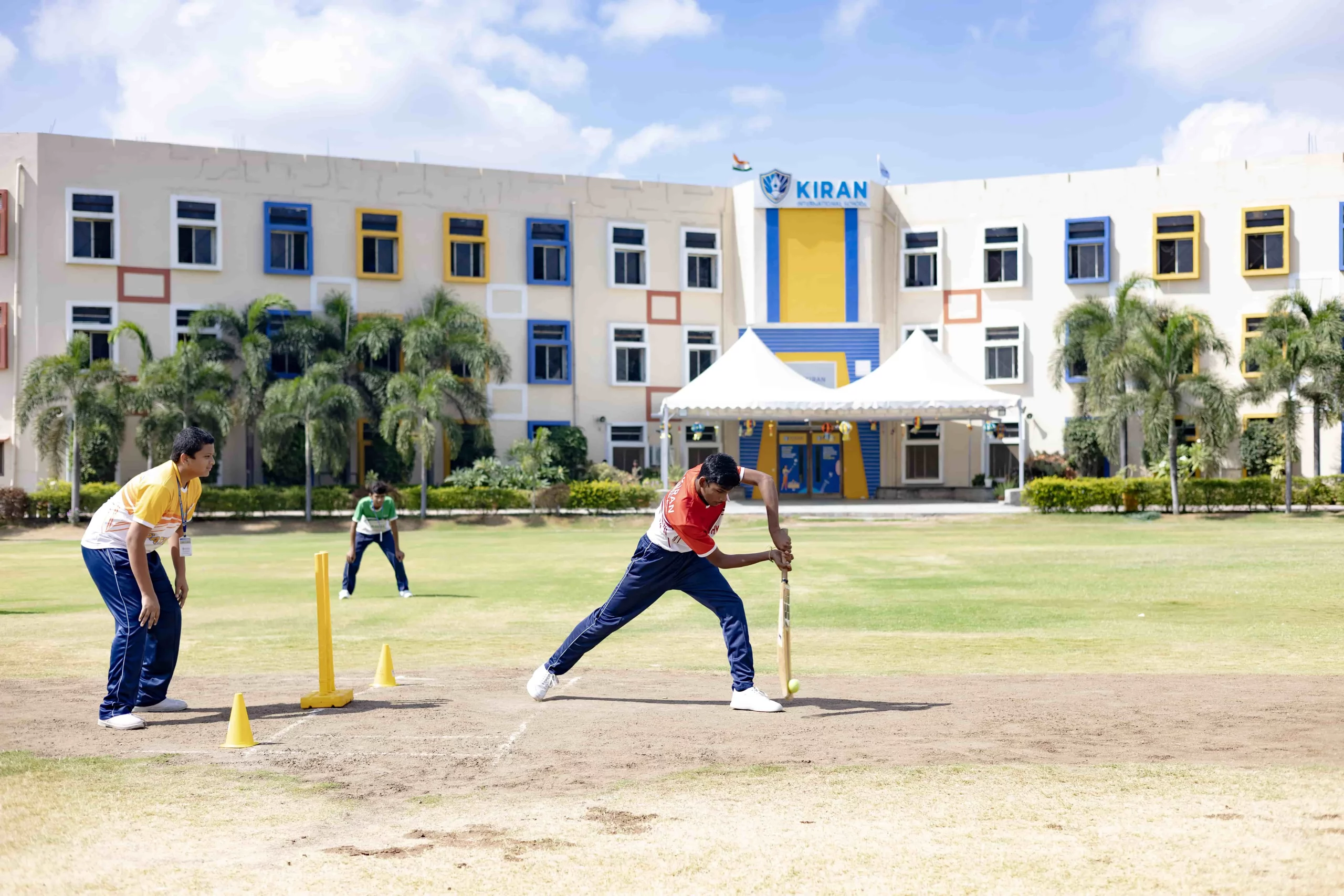 students are playing cricket