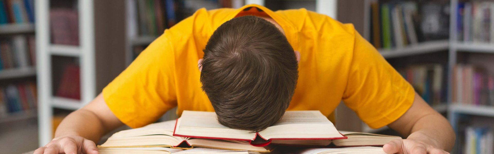 Student is sleeping on book