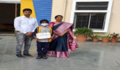 schools kids with certificate